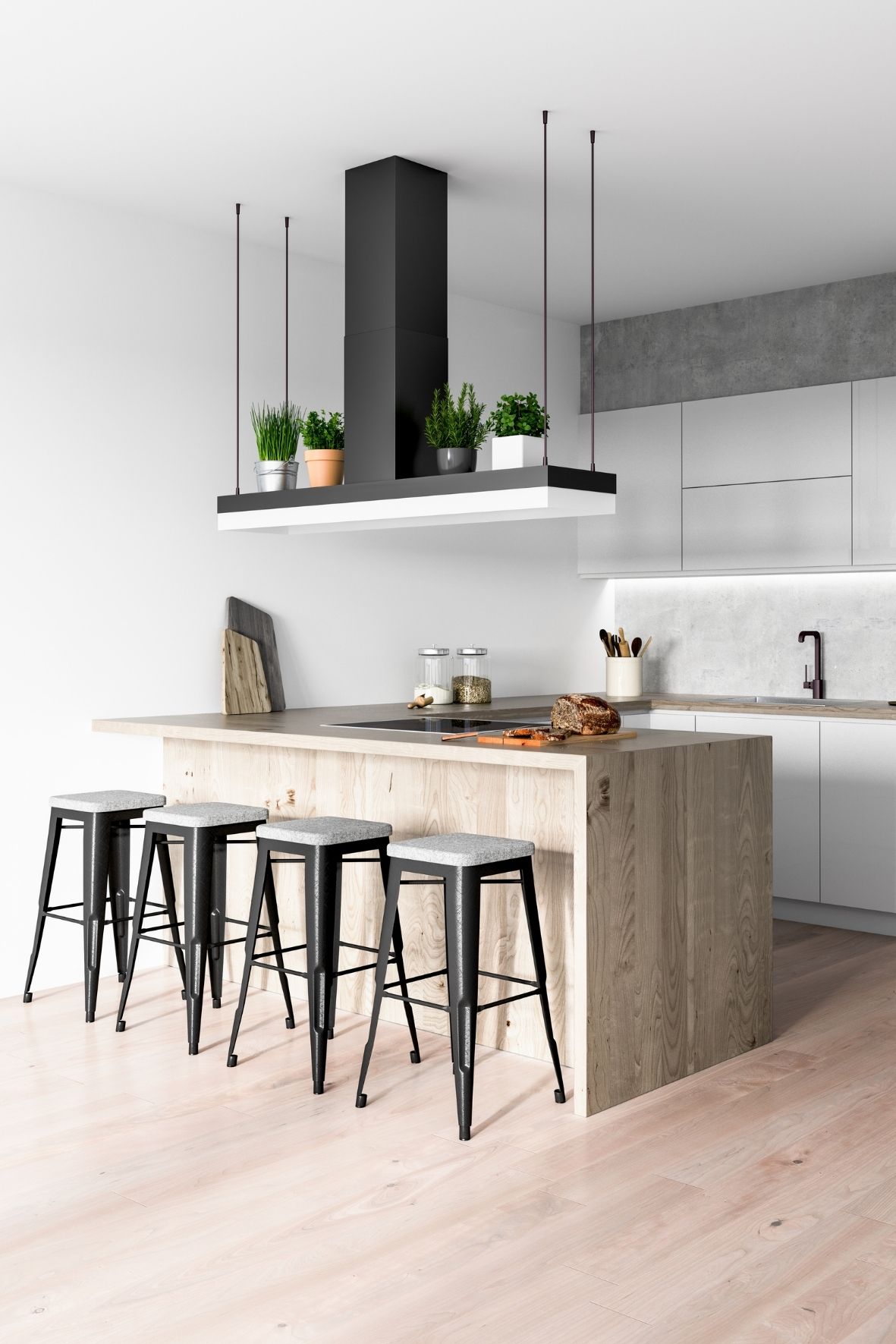 Cuisine avec grand îlot en pierre, luminaires suspendus et espace repas ouvert dans une résidence  dans le Sud-Ouest de Montréal